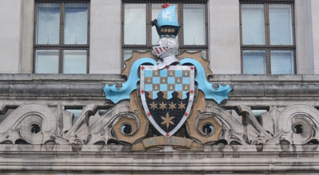 Coat of Arms on Wandsworth Town Hall, showing the tears of the Huguenots in blue on a chequerboard