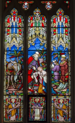 The Good Samaritan depicted in a window at St Peter's Church, Doddington
